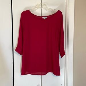 Red top/blouse. Size Medium. Worn once for a short time.